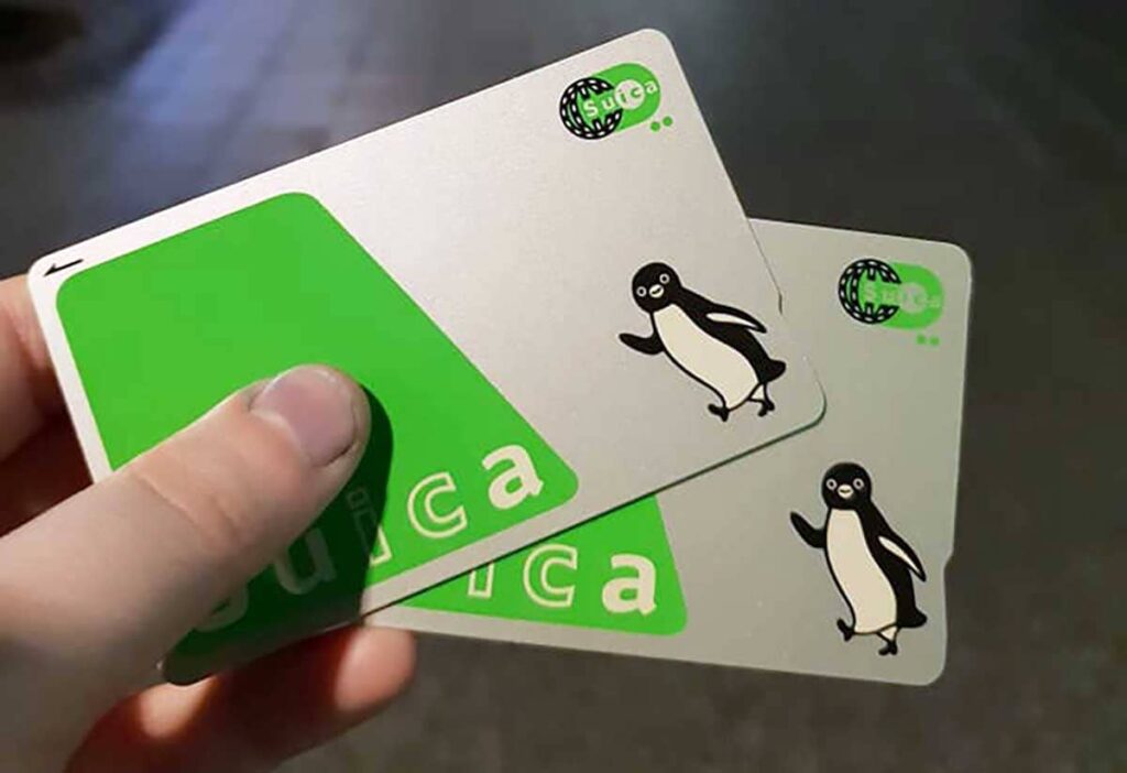 Suica Smart prepaid Japanese IC Card green silver with Penguin logo used for public transport payment in Japan